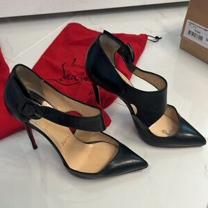 AUTHENTIC Sharpeta 100 Nappa heels with red sole protectors attached.